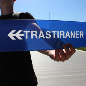 Person holding airport transfer sign